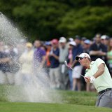 Belgium's Nicolas Colsaerts hits from a sand trap to the first green during the second round of the 2013 U.S. Open golf championship at the 