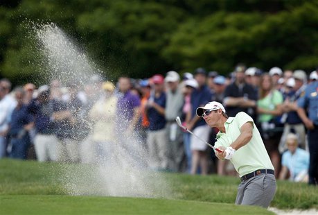 Belgium's Nicolas Colsaerts hits from a sand trap to the first green during the second round of the 2013 U.S. Open golf championship at the Belgium's Nicolas Colsaerts hits from a sand trap to the first green during the second round of the 2013 U.S. Open golf championship at the