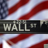 The Wall Street sign is seen outside the New York Stock Exchange, March 26, 2009. REUTERS/Chip East