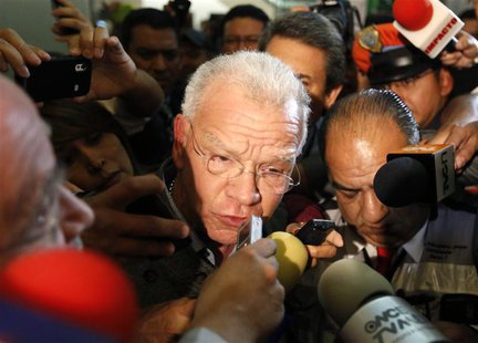 Andres Granier (C), former governor of Tabasco state, speaks to the media upon his arrival at the international airport in Mexico City June Andres Granier (C), former governor of Tabasco state, speaks to the media upon his arrival at the international airport in Mexico City June