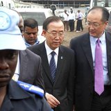 A U.N. peacekeeper escorts U.N. Secretary-General Ban Ki-moon and World Bank President Jim Yong Kim (R) during their joint trip to Goma, in 