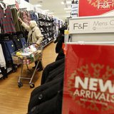 A customer shops for clothing at a Tesco shop in Bishop's Stortford, southern England November 26, 2012. REUTERS/Suzanne Plunkett