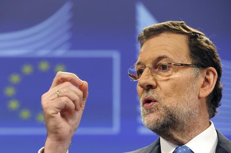 Spain's Prime Minister Mariano Rajoy attends a news conference at the European Commission in Brussels June 5, 2013. REUTERS/Laurent Dubrule Spain's Prime Minister Mariano Rajoy attends a news conference at the European Commission in Brussels June 5, 2013. REUTERS/Laurent Dubrule
