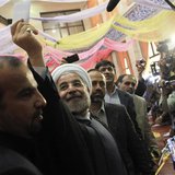 Presidential candidate Hassan Rohani shows his ballot before casting it during the Iranian presidential election in Tehran June 14, 2013. RE