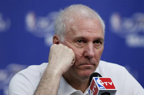 San Antonio Spurs coach Gregg Popovich listens to a media question after practice for their NBA Finals basketball playoff series against the San Antonio Spurs coach Gregg Popovich listens to a media question after practice for their NBA Finals basketball playoff series against the