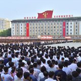 People attend a mass rally at Kim Il Sung Square in Pyongyang, in this photo released by North Korea's Korean Central News Agency (KCNA) on 