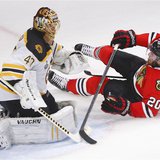 Chicago Blackhawks' Brandon Saad (R) slides into the net behind Boston Bruins goalie Tuukka Rask during the sceond period in Game 2 of their Chicago Blackhawks' Brandon Saad (R) slides into the net behind Boston Bruins goalie Tuukka Rask during the sceond period in Game 2 of their