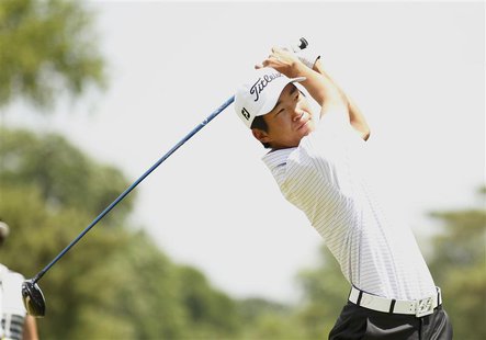 Amateur Michael Kim of the U.S. tees off on the second hole during the third round of the 2013 U.S. Open golf championship at the Merion Gol Amateur Michael Kim of the U.S. tees off on the second hole during the third round of the 2013 U.S. Open golf championship at the Merion Gol