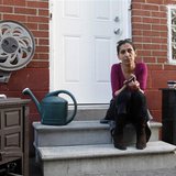 Viktoria Mohacsi sits at the door of the house, where she rents the basement apartment, in Toronto, May 9, 2013. REUTERS/Mirjam Donath Viktoria Mohacsi sits at the door of the house, where she rents the basement apartment, in Toronto, May 9, 2013. REUTERS/Mirjam Donath