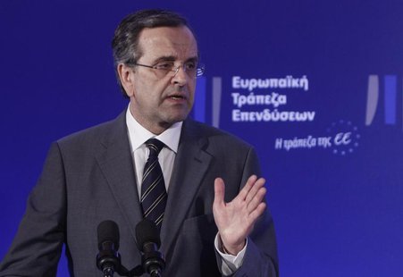 Greece's Prime Minister Antonis Samaras gestures as he delivers his speech during an agreement signing with the European Investment Bank (EI Greece's Prime Minister Antonis Samaras gestures as he delivers his speech during an agreement signing with the European Investment Bank (EI