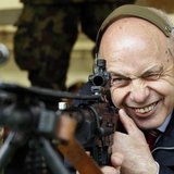 Swiss President Ueli Maurer aims at a target at 300 metres (984.25 feet) distance during a shooting exercise together with the Foreign Diplo