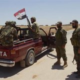 Forces loyal to Syria's President Bashar al-Assad are seen in Ain-Assan village during what they said was an operation to occupy it, in sout Forces loyal to Syria's President Bashar al-Assad are seen in Ain-Assan village during what they said was an operation to occupy it, in sout