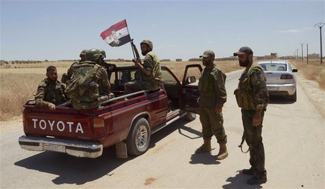Forces loyal to Syria's President Bashar al-Assad are seen in Ain-Assan village during what they said was an operation to occupy it, in sout Forces loyal to Syria's President Bashar al-Assad are seen in Ain-Assan village during what they said was an operation to occupy it, in sout
