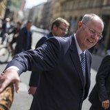The top-candidate of the Social Democratic Party (SPD) in this year's German general election Peer Steinbrueck shakes hands with a passerby 