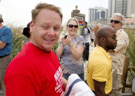 Tightrope walker Nik Wallenda winks as he exits the beach after walking a high wire over the California Avenue beach in Atlantic City, New J Tightrope walker Nik Wallenda winks as he exits the beach after walking a high wire over the California Avenue beach in Atlantic City, New J