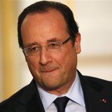 France's President Francois Hollande reacts during a joint news conference with Canada's Prime Minister Stephen Harper (not pictured) at the