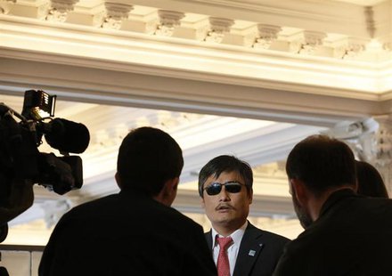 Chinese dissident Chen Guangcheng speaks to journalists following an appearance in New York May 3, 2013. REUTERS/Brendan McDermid Chinese dissident Chen Guangcheng speaks to journalists following an appearance in New York May 3, 2013. REUTERS/Brendan McDermid