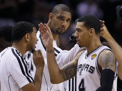 San Antonio Spurs' Danny Green (R), Tim Duncan (C) and Cory Joseph celebrate during a timeout in second quarter play against the Miami Heat San Antonio Spurs' Danny Green (R), Tim Duncan (C) and Cory Joseph celebrate during a timeout in second quarter play against the Miami Heat