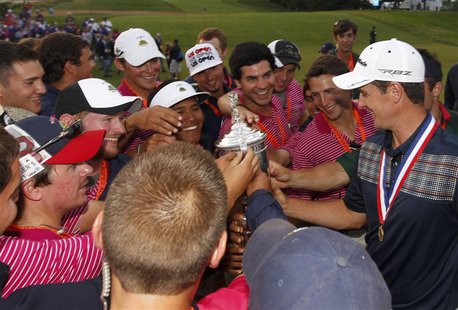 England's Justin Rose (R) shows off the U.S. Open Trophy after winning the 2013 U.S. Open golf championship at the Merion Golf Club in Ardmo England's Justin Rose (R) shows off the U.S. Open Trophy after winning the 2013 U.S. Open golf championship at the Merion Golf Club in Ardmo
