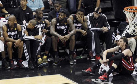 Miami Heat's LeBron James (6) sits with his teammates near the end of their loss to the San Antonio Spurs in Game 5 of their NBA Finals bask Miami Heat's LeBron James (6) sits with his teammates near the end of their loss to the San Antonio Spurs in Game 5 of their NBA Finals bask