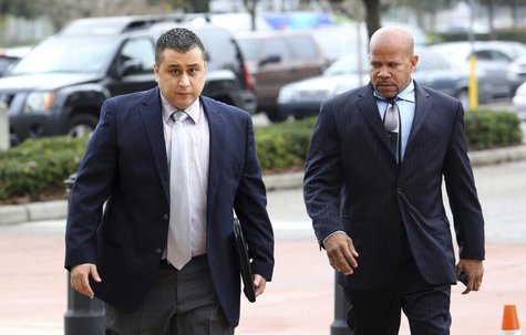 George Zimmerman is escorted by a private security guard as he arrives for a hearing in Sanford, Florida, December 11, 2012. REUTERS/Joe Bur George Zimmerman is escorted by a private security guard as he arrives for a hearing in Sanford, Florida, December 11, 2012. REUTERS/Joe Bur
