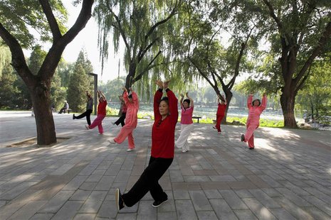 People practise tai chi, a Chinese martial art, during morning exercises at Longtan Park in Beijing in this September 13, 2010 file photo. R People practise tai chi, a Chinese martial art, during morning exercises at Longtan Park in Beijing in this September 13, 2010 file photo. R