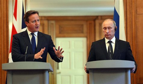 Britain's Prime Minister David Cameron (L) and Russia's President Vladimir Putin hold a joint news conference in 10 Downing Street, central Britain's Prime Minister David Cameron (L) and Russia's President Vladimir Putin hold a joint news conference in 10 Downing Street, central