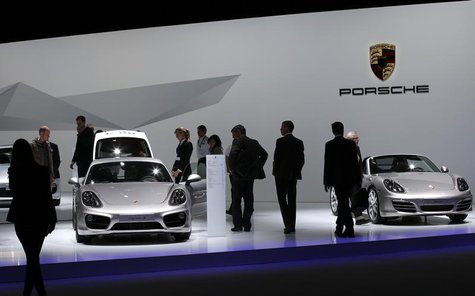 Shareholders watch Porsche cars during the annual shareholders meeting of Porsche in Leipzig, April 30, 2013. REUTERS/Fabrizio Bensch Shareholders watch Porsche cars during the annual shareholders meeting of Porsche in Leipzig, April 30, 2013. REUTERS/Fabrizio Bensch