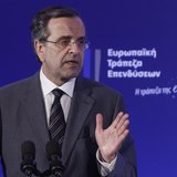 Greece's Prime Minister Antonis Samaras gestures as he delivers his speech during an agreement signing with the European Investment Bank (EI