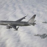 The Boeing 767-based NewGen Tanker is pictured simultaneously refueling two F/A-18 Super Hornet aircraft from the wing air refueling pods in