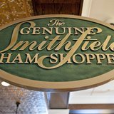 A sign advertising Smithfield hams hangs at the Taste of Smithfield restaurant and gourmet market in Smithfield, Virginia May 30, 2013. REUT