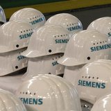 Saftey helmets are piled up for media representatives at the Siemens AG gas turbine factory hall in Berlin November 8, 2012. REUTERS/Tobias 