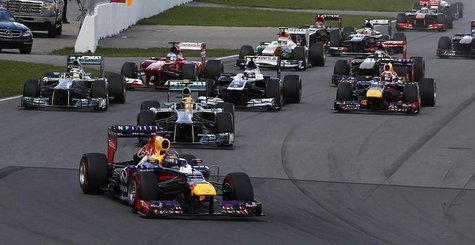 Drivers take a corner during the Canadian F1 Grand Prix at the Circuit Gilles Villeneuve in Montreal June 9, 2013. REUTERS/Chris Wattie Drivers take a corner during the Canadian F1 Grand Prix at the Circuit Gilles Villeneuve in Montreal June 9, 2013. REUTERS/Chris Wattie