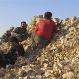 Free Syrian Army fighters take positions in Deraa during what they said an offensive to liberate the checkpoint No. 41, a border point with 