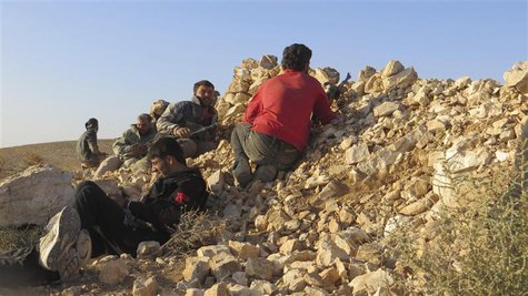 Free Syrian Army fighters take positions in Deraa during what they said an offensive to liberate the checkpoint No. 41, a border point with Free Syrian Army fighters take positions in Deraa during what they said an offensive to liberate the checkpoint No. 41, a border point with
