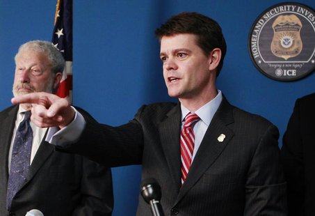U.S. Immigration and Customs Enforcement Director John Morton (R) answers questions from the media next to U.S. Holocaust Memorial Museum Se U.S. Immigration and Customs Enforcement Director John Morton (R) answers questions from the media next to U.S. Holocaust Memorial Museum Se