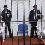 Mohammed Zwai (L), former secretary general of Libya's General People's Congress, and Abdel-Ati al-Obeidi, former foreign minister, sit behi Mohammed Zwai (L), former secretary general of Libya's General People's Congress, and Abdel-Ati al-Obeidi, former foreign minister, sit behi