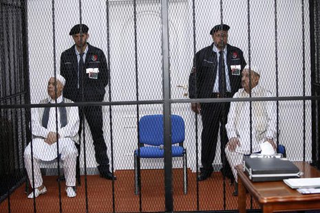 Mohammed Zwai (L), former secretary general of Libya's General People's Congress, and Abdel-Ati al-Obeidi, former foreign minister, sit behi Mohammed Zwai (L), former secretary general of Libya's General People's Congress, and Abdel-Ati al-Obeidi, former foreign minister, sit behi