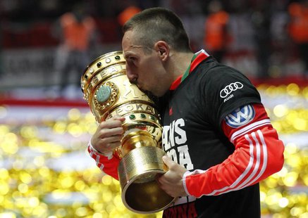Bayern Munich's Franck Ribery kisses the trophy as he celebrates their victory over VfB Stuttgart in their German soccer cup (DFB Pokal) fin Bayern Munich's Franck Ribery kisses the trophy as he celebrates their victory over VfB Stuttgart in their German soccer cup (DFB Pokal) fin