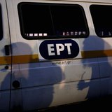 Protesters cast their shadows on a state broadcaster ERT van outside its headquarters in Athens June 16, 2013. REUTERS/Yorgos Karahalis