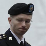 U.S. Army Private First Class Bradley Manning enters the courtroom for day four of his court martial at Fort Meade, Maryland June 10, 2013. 