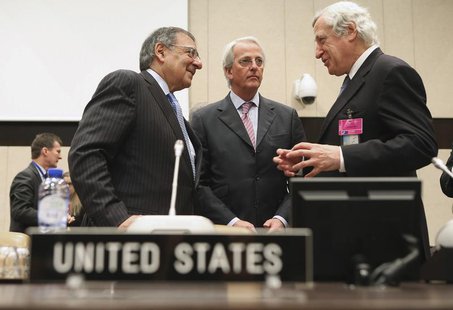 U.S. Secretary of Defense Leon Panetta (L) speaks with U.S. Ambassador to the North Atlantic Treaty Organization Ivo Daalder (C) and Europea U.S. Secretary of Defense Leon Panetta (L) speaks with U.S. Ambassador to the North Atlantic Treaty Organization Ivo Daalder (C) and Europea