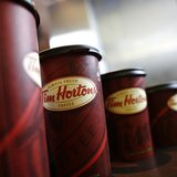 A row of Tim Hortons coffee cups are lined up for customers at Penn Station in New York, July 13, 2009. REUTERS/Brendan McDermid