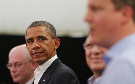 U.S. President Barack Obama glances at Britain's Prime Minister David Cameron (R) during a news conference with European Union officials at U.S. President Barack Obama glances at Britain's Prime Minister David Cameron (R) during a news conference with European Union officials at