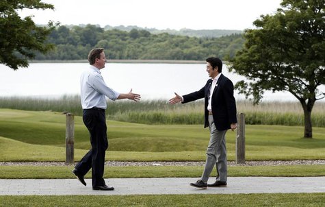 British Prime Minister David Cameron (L) welcomes Japanese Prime Minister Shinzo Abe for the first plenary session of the G8 Summit at Lough British Prime Minister David Cameron (L) welcomes Japanese Prime Minister Shinzo Abe for the first plenary session of the G8 Summit at Lough