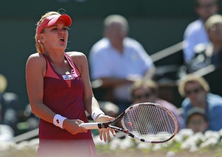 Agnieszka Radwanska of Poland reacts during her women's singles quarter-final match against Sara Errani of Italy at the French Open tennis t Agnieszka Radwanska of Poland reacts during her women's singles quarter-final match against Sara Errani of Italy at the French Open tennis t