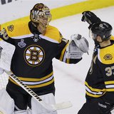 Boston Bruins' Patrice Bergeron (R) congratulates goalie Tuukka Rask after his shutout win over the Chicago Blackhawks in Game 3 of their NH Boston Bruins' Patrice Bergeron (R) congratulates goalie Tuukka Rask after his shutout win over the Chicago Blackhawks in Game 3 of their NH