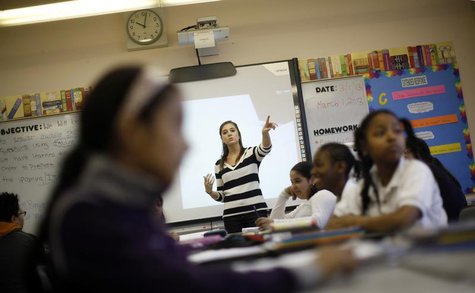 Teacher Jaclyn Kruljac speaks to her students in 5th grade class at Walsh Elementary School in Chicago, Illinois, March 1, 2013. REUTERS/Jim Teacher Jaclyn Kruljac speaks to her students in 5th grade class at Walsh Elementary School in Chicago, Illinois, March 1, 2013. REUTERS/Jim