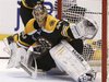 Boston Bruins goalie Tuukka Rask makes a glove save in the third period against the Chicago Blackhawks in Game 3 of their NHL Stanley Cup Fi