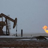 Natural gas flares are seen at an oil pump site outside of Williston, North Dakota March 11, 2013. REUTERS/Shannon Stapleton Natural gas flares are seen at an oil pump site outside of Williston, North Dakota March 11, 2013. REUTERS/Shannon Stapleton